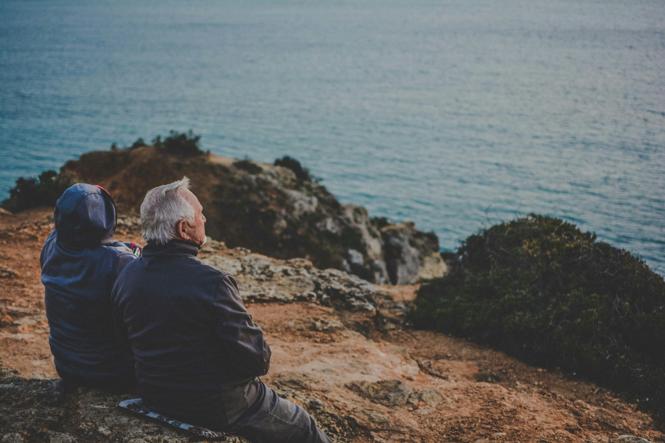 older people watching ocean