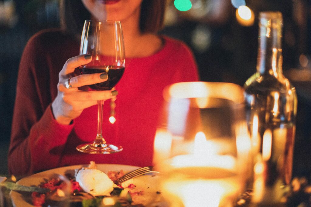 woman at table having a drink