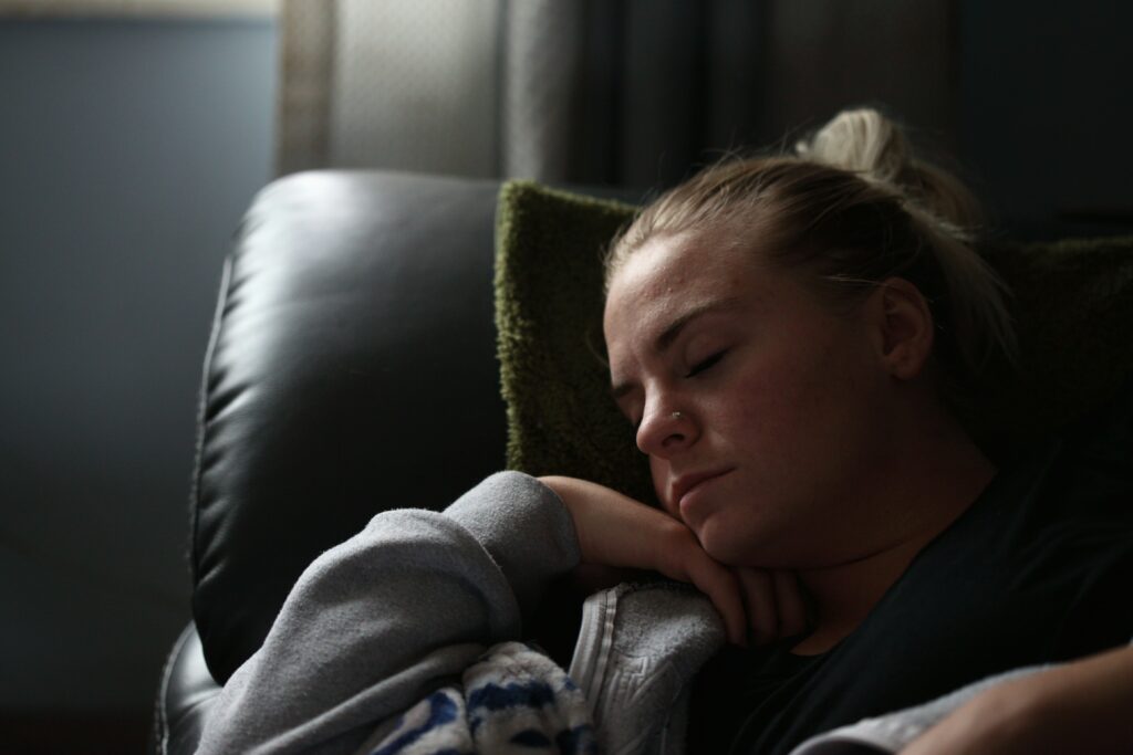 woman sleeping on couch